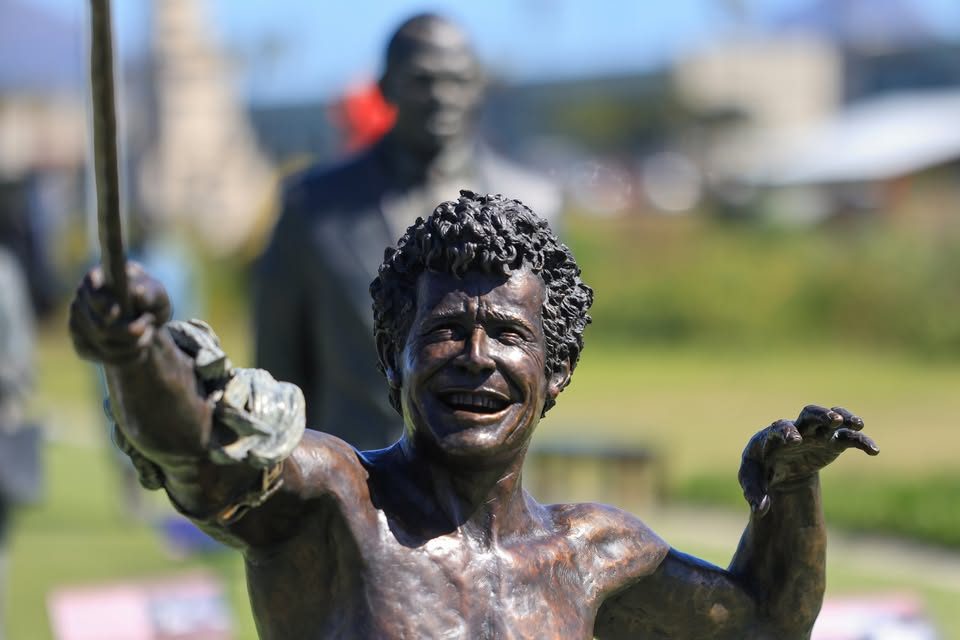 Smiling bronze statue at the Long March to Freedom exhibition