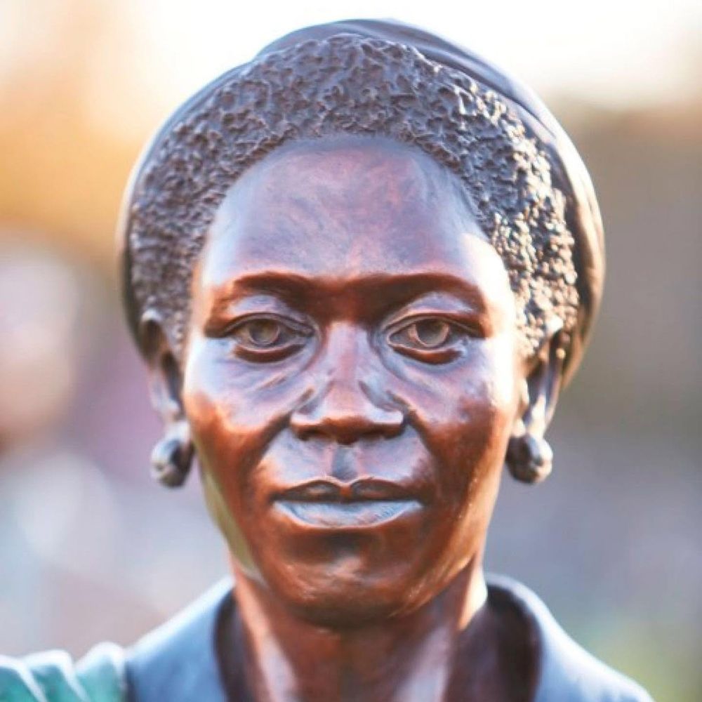 Close-up of a bronze statue’s face