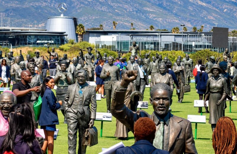 School learners exploring the bronze statues